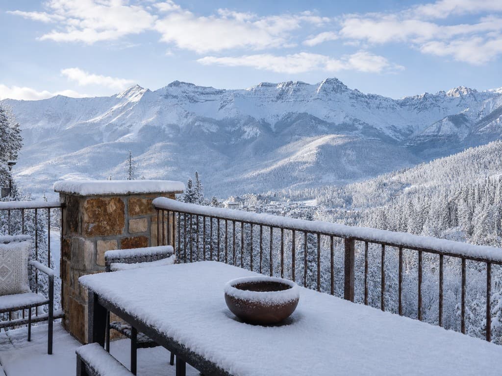 Snow-covered patio overlooking Mountain Village and the Sundance ski run